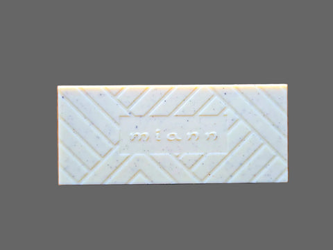 Rectangular bar of Chocolate with 'miann' branding on a wooden surface
